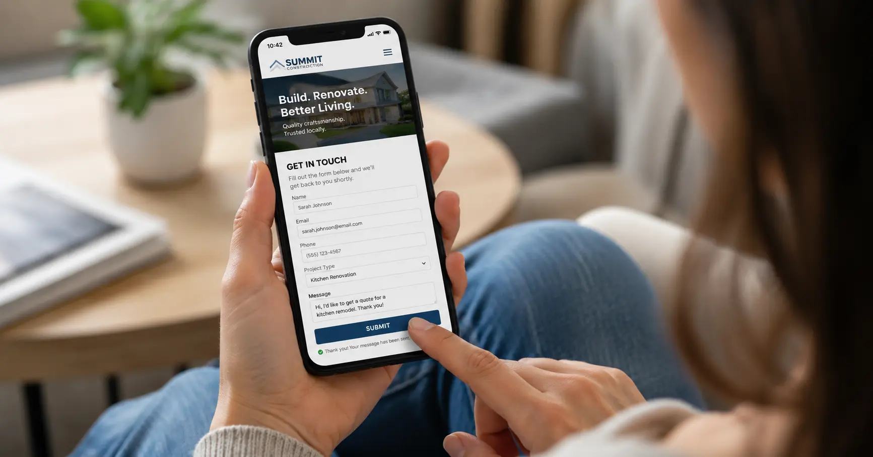 Homeowner submitting a contact form on a contractor website on a phone